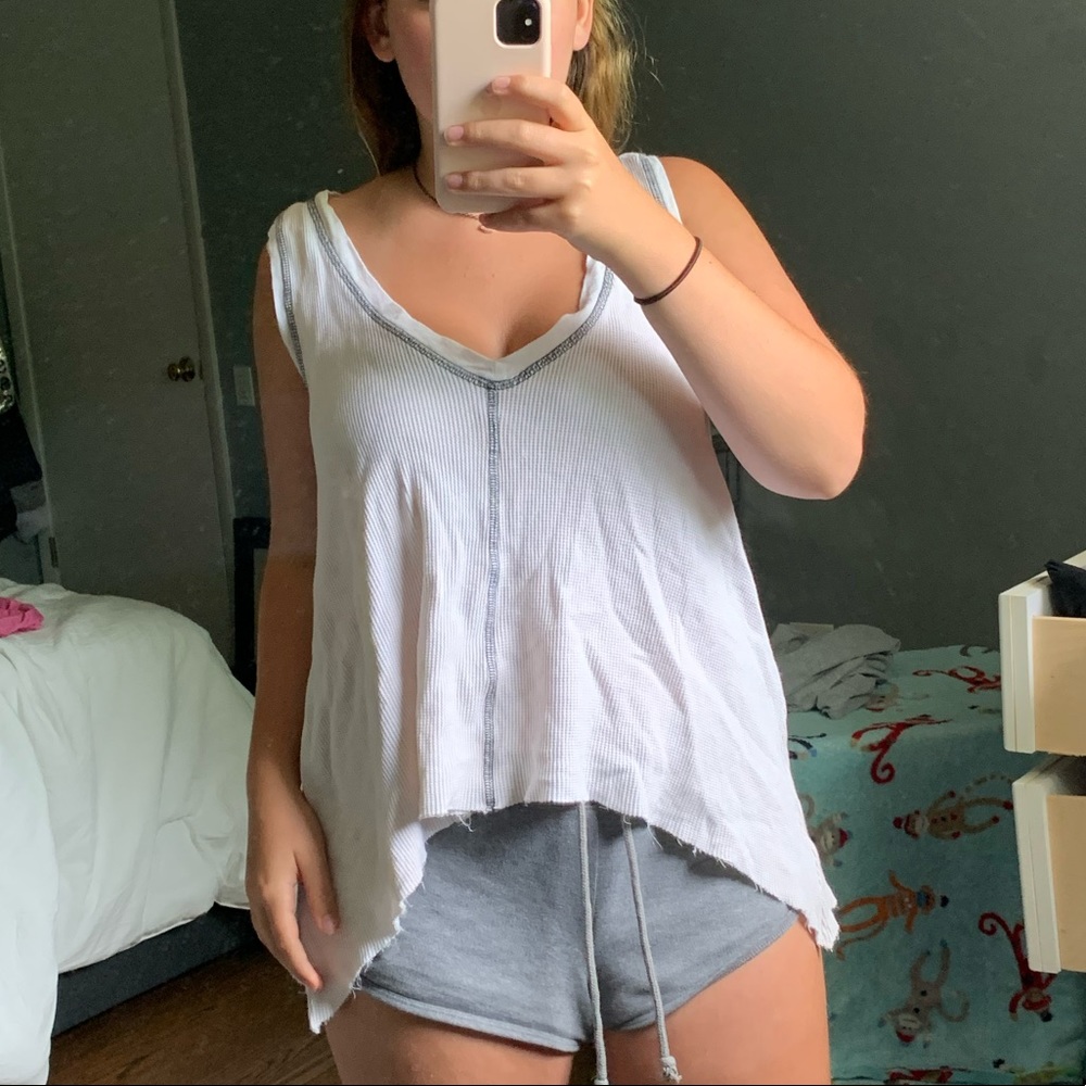 Cream flowy tank top with blue stitching!